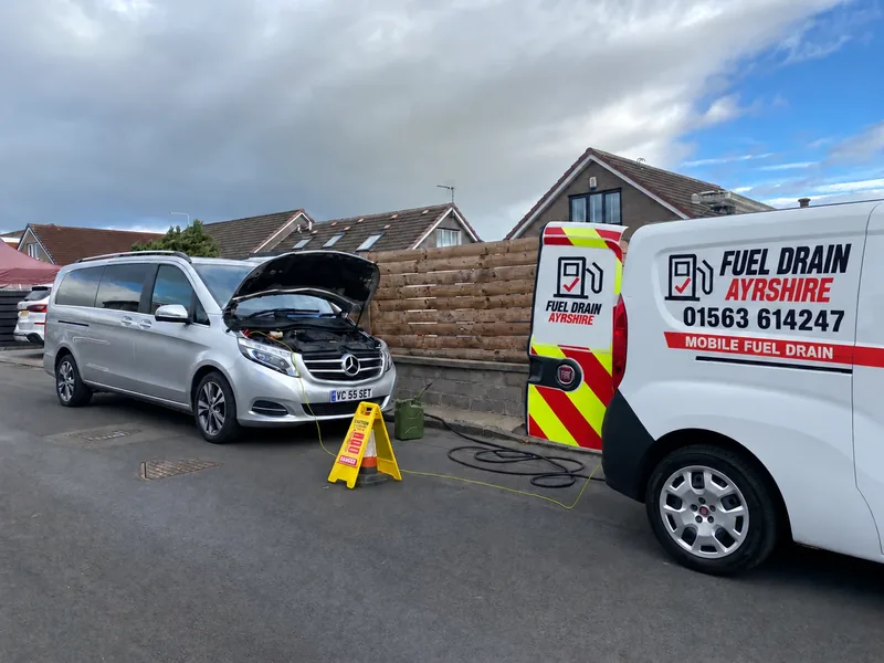 Fuel Drain Ayrshire van beside a silver Mercedes with its bonnet open — AI-edited livery concept